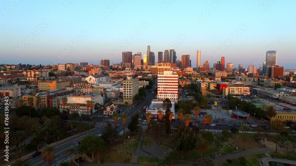 Aerial Panning Shot Of Modern Downtown District In City Against Clear Sky During Sunset - Los Angeles, California Aerial Panning Shot Of Modern Downtown District In City Against Clear Sky During Sunset - Los Angeles, California