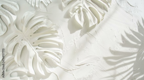 Abstract white plaster relief with tropical monstera leaf patterns casting soft shadows © BrightWhite