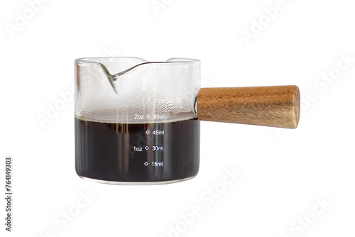 Measuring cup with wooden handle on white background