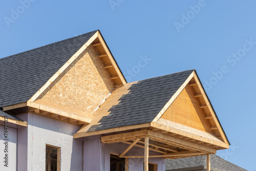 Dormers of a residential construction project showing plywood roof and oriented strand board or chip board dormer sheathing