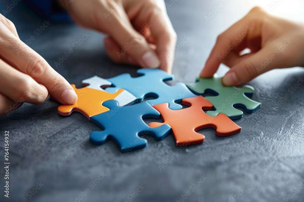 People putting together puzzle. People putting together puzzle.