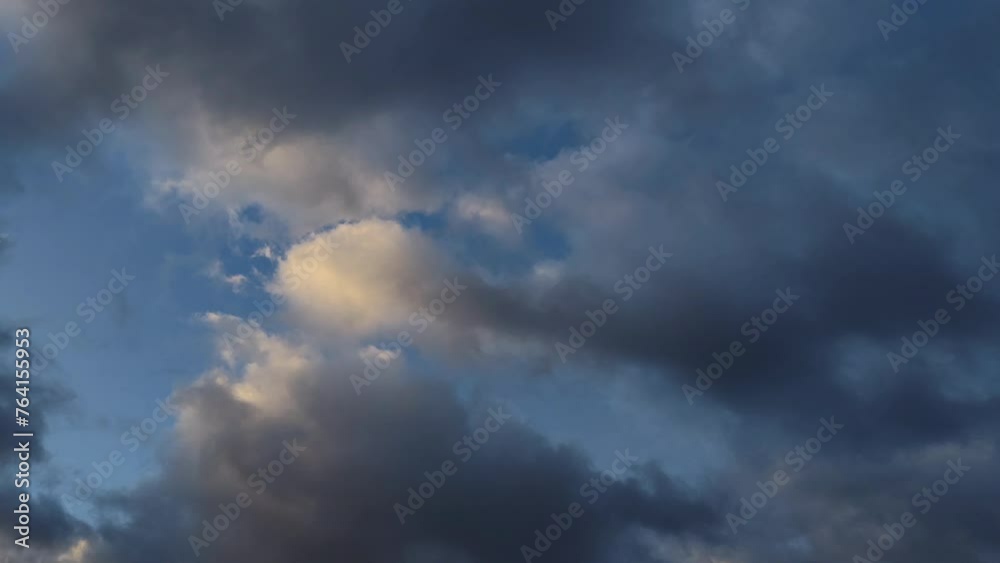 Small clusters of clouds are becoming more orange in color Small clusters of clouds are becoming more orange in color
