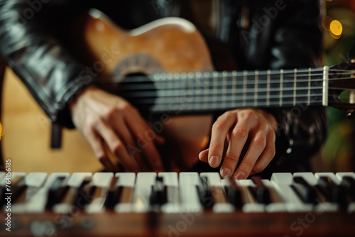 Musician Playing Guitar and Keyboard in Studio.