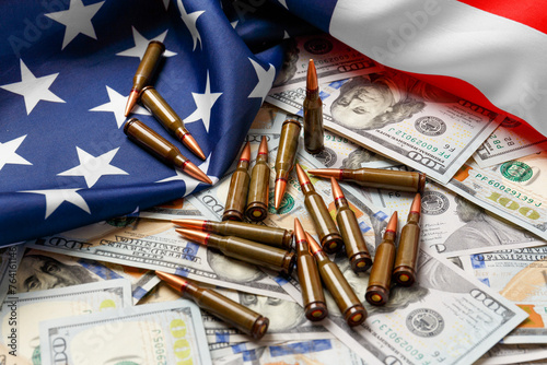 American flag, dollars, bullets, cartridges, ammunition.