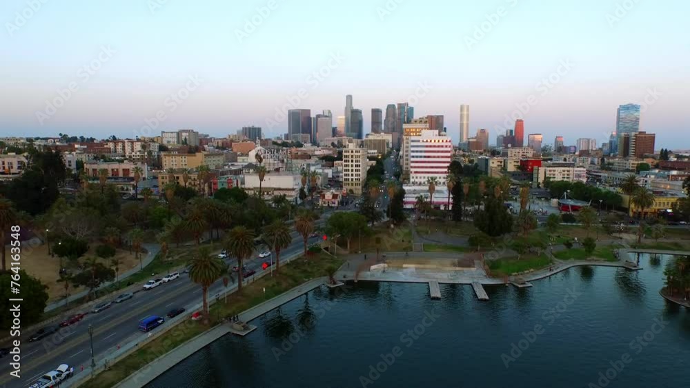 Aerial Panning Shot Of Scenic View Of Modern Buildings In City, Drone Flying Over Rippled Lake At Sunset - Los Angeles, California Aerial Panning Shot Of Scenic View Of Modern Buildings In City, Drone Flying Over Rippled Lake At Sunset - Los Angeles, California