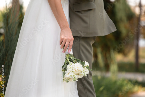 Wedding bouquet in the hands of the bride, close-up