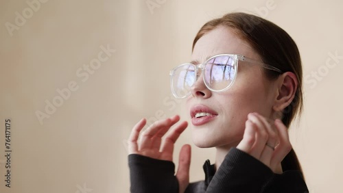 girl with glasses in close-up. Headache, fatigue concept.