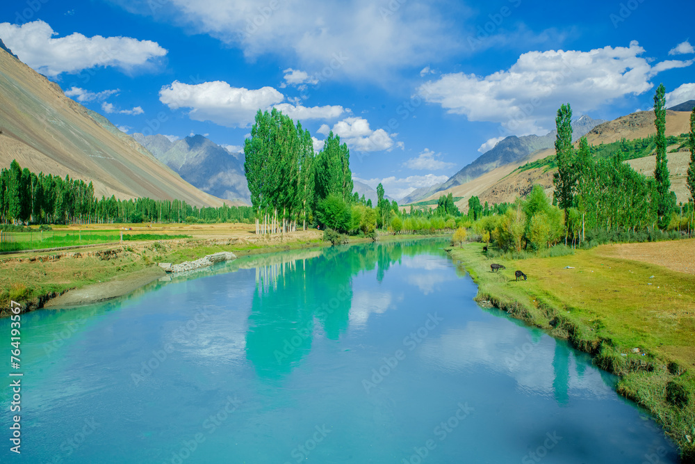 Beautiful lake surrounded by green mountains and trees Beautiful lake surrounded by green mountains and trees