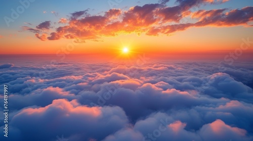  A plane views the sunset behind clouds in the sky © Jevjenijs