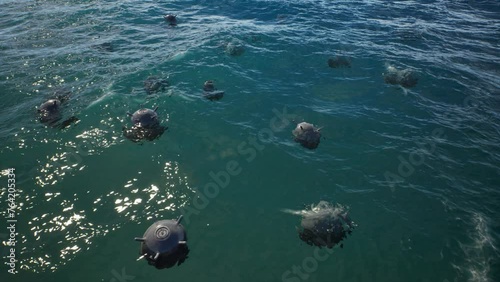 Mines float on the waves in the sea