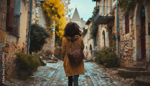 A female walking down the streets of a beautiful old European town