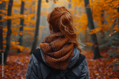 Woman in Autumn Forest Observing Nature.