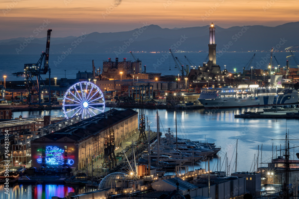 Panoramic view of the city of Genoa from the Spianata Castelletto at dusk.