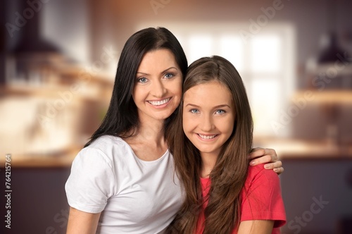 Cheerful Mother And Daughter have fun together at home