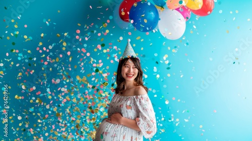 A joyful woman celebrates with balloons and confetti © StasySin