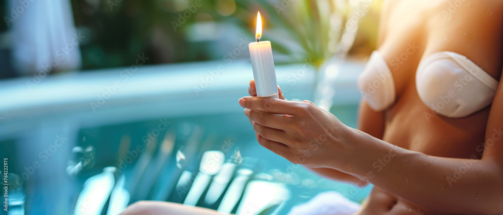 Woman hold cosmetic candle on swimming pool in spa centre. Cozy romantic ambience. Beautiful female has aromatherapy relax. Body Care. Cosmetology mock up. Wellness, recreation. Generative ai - obrazy, fototapety, plakaty 