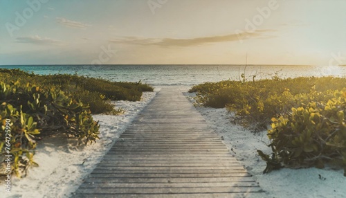 boardwalk leading to the white sand beach 