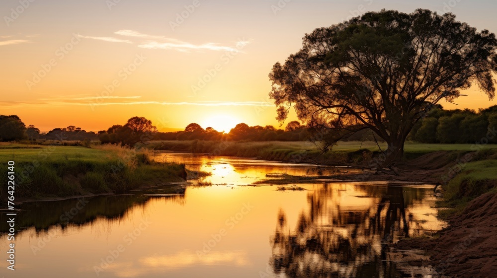 Tranquil river with reflections at sunset time