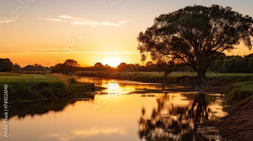 Tranquil river with reflections at sunset time