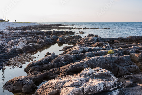 Fototapeta Naklejka Na Ścianę i Meble -  Idyllic rocky beach in tourist coastal town Medulin, Istria peninsula, Croatia, Europe. Panoramic view of rugged coastline of Kvarner Gulf in Adriatic Mediterranean Sea in summer. Travel destination