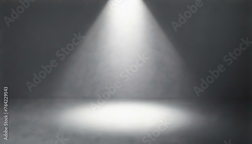  Defocused view on empty studio background lit from top by round spotlight
