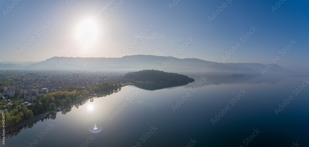 Ohrid Lake in North Macedonia. Beautiful Sunlight and Mountain in Background Ohrid Lake in North Macedonia. Beautiful Sunlight and Mountain in Background