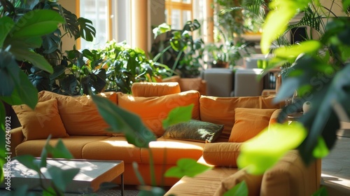 A living room with couches and green plants.