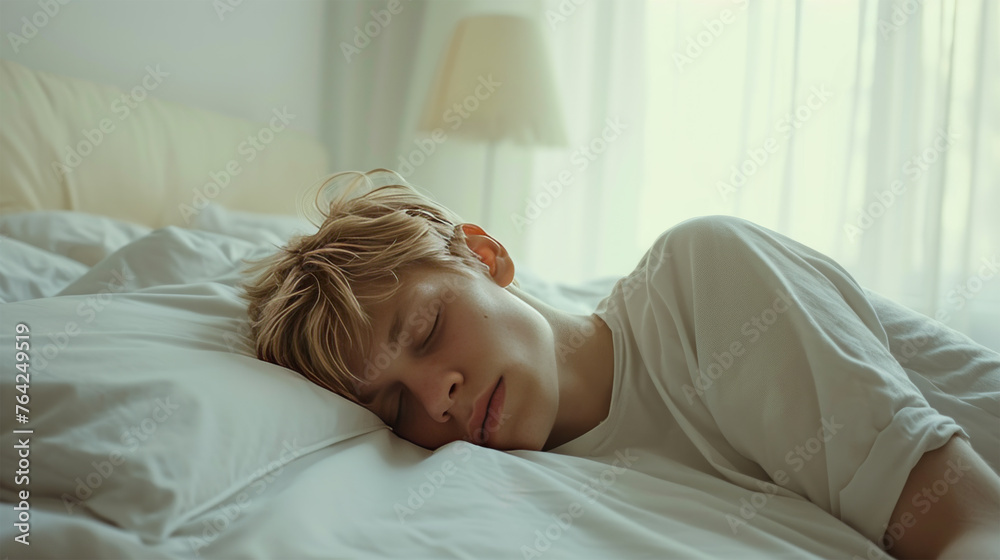 A 30-year-old man sleeps on a white bed. A 30-year-old man sleeps on a white bed.