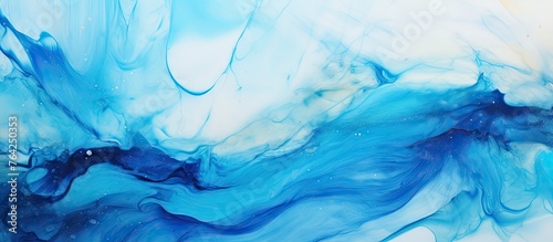 Blue and white fluid paint on a white background