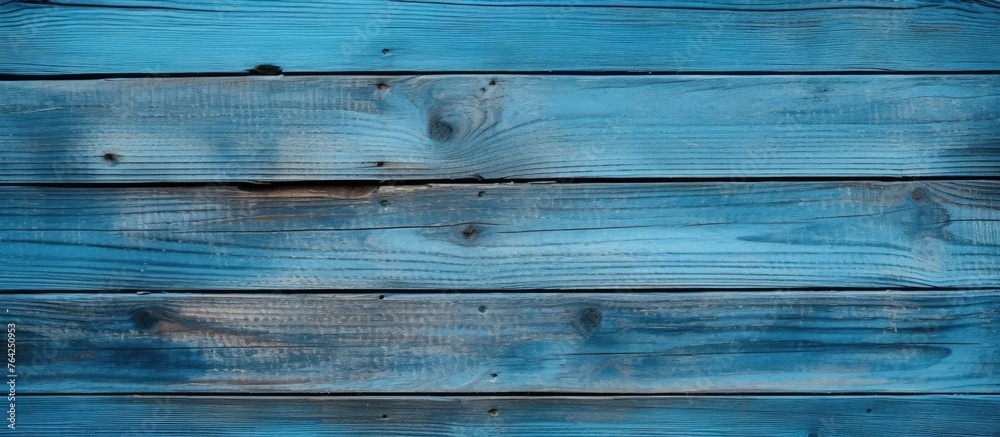 Fototapeta premium Close up of a hole in a blue wooden wall