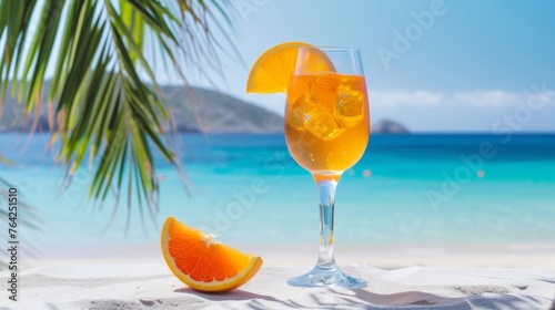 summer background. Fruit alcoholic cocktail on the beach in the sand against the background of the sea