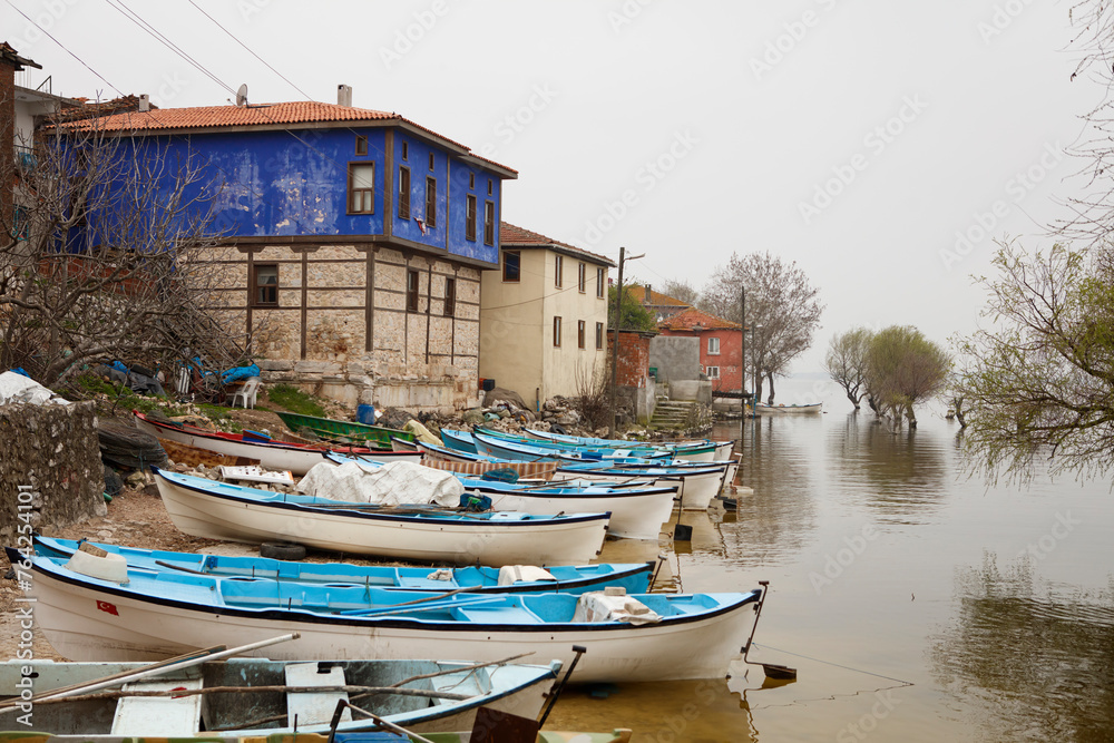 Obraz premium Fishing boats on the shores of Lake Apolyont. Touristic fishing village, Gölyazı, Bursa, Türkiye