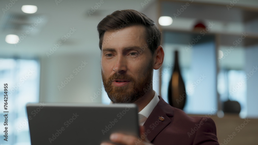 Millennial man tablet conference office closeup. Businessman explaining alone