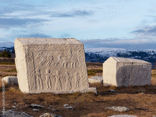 Stecci Medieval Tombstones Graveyards Dugo Polje in Blidinje, BiH. Unesco site. Historic place of interest. The tombstones feature a wide range of decorative motifs and inscriptions. photo