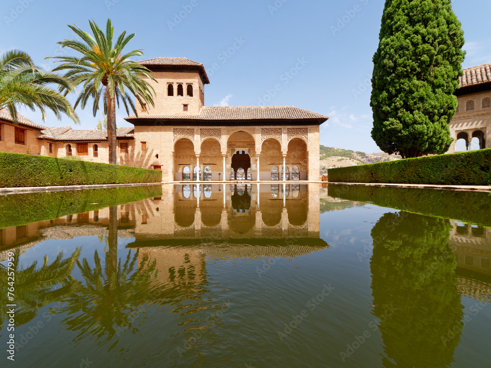 Garden of the Partal,  Alhambra Granada. Reflection in the water. Moorish Architecture. Unesco Unesco World Heritage Spain. Travel in time and discover history. 