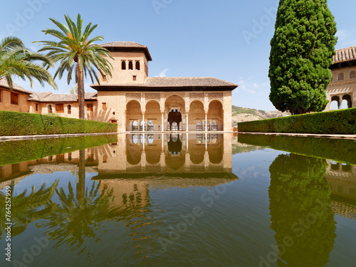 Garden of the Partal,  Alhambra Granada. Reflection in the water. Moorish Architecture. Unesco Unesco World Heritage Spain. Travel in time and discover history.  photo