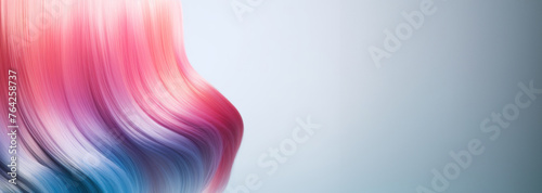 A woman with vibrant pink and blue hair styled in long waves, standing confidently. Cosmetic hair care product. Hair health and tone. Modeling agency. Banner. Copy space