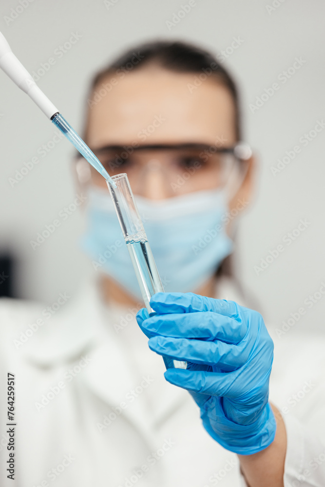 Medical research laboratory. A scientist works with a pipette and a test tube. Scientific laboratory of biotechnology, development of medicine and research in chemistry, biochemistry and experiments