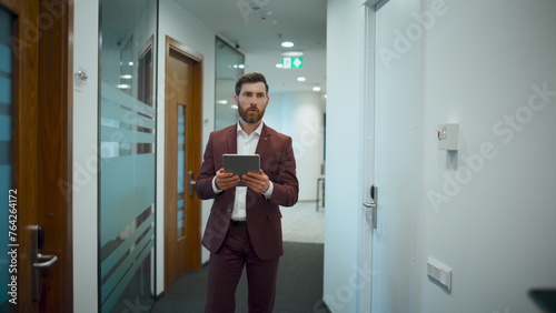 Wallpaper Mural Businessman using tablet computer office. Entrepreneur greeting at corridor Torontodigital.ca