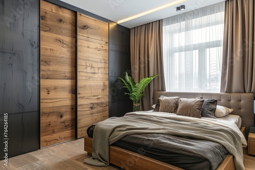 Luxurious bedroom showcasing a dark wood wardrobe with a contrasting light wood sliding door, exuding a modern and sophisticated vibe.