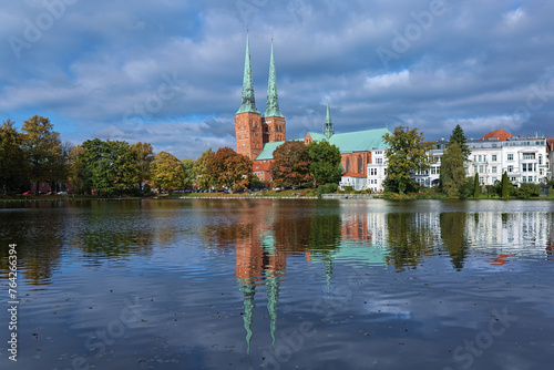 Lubeck, Germany. View of Lubeck Cathedral from the opposite shore of Muhlenteich (Mill pond) in autumn day. The cathedral was started in 1173 and consecrated in 1247.