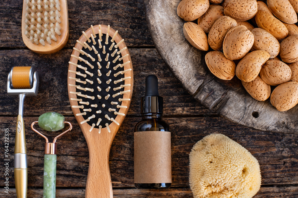 Nut oils with rollers. Beauty care tools on the table. 
