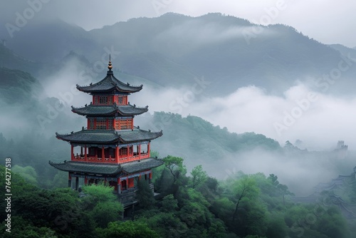 A towering structure stands tall atop a vibrant green hill, dominating the picturesque landscape, A Chinese pagoda in a misty mountain setting, AI Generated