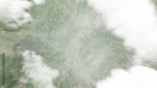 Earth zoom in from space to Berane, Montenegro. Followed by zoom out through clouds and atmosphere into space. Satellite view. Travel intro. Images from NASA photo