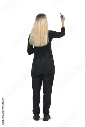 back view of a woman drawing or writing imaginatively upwards on white background.