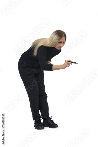  view of a woman drawing or writing imaginatively downwards on white background.
