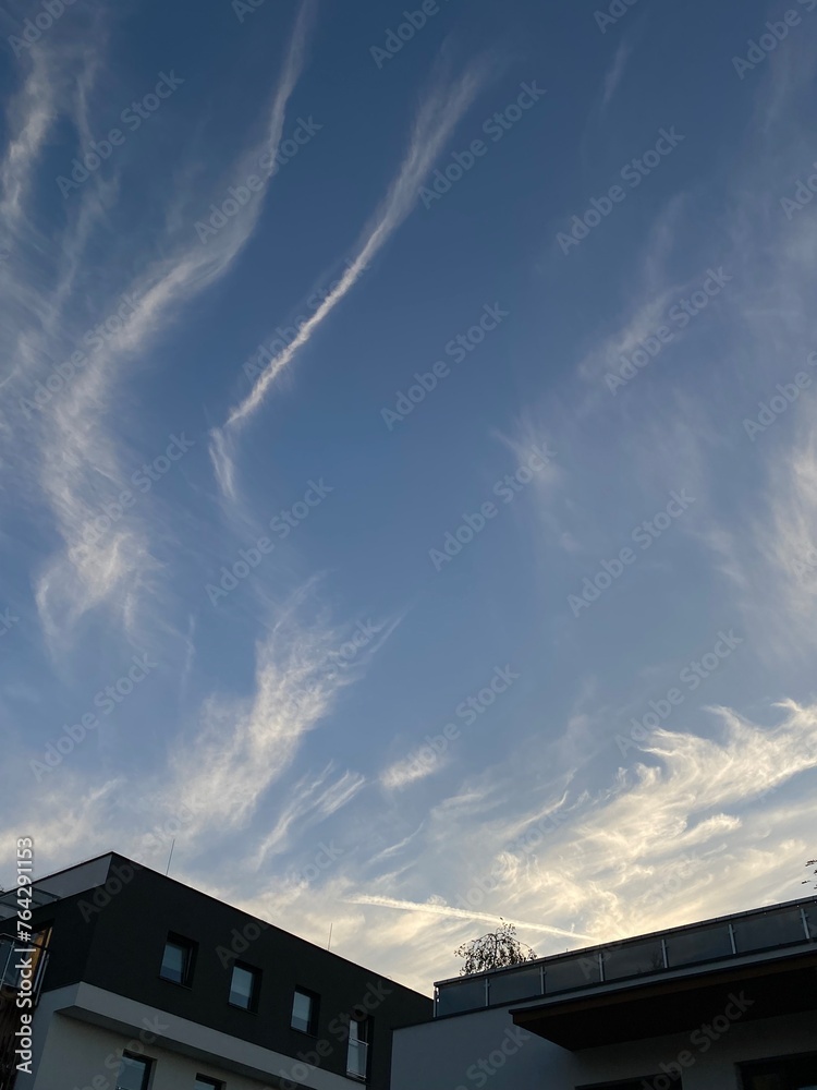 blue sky with traces of aircraft - obrazy, fototapety, plakaty 