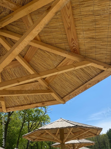 wooden umbrella against the blue sky