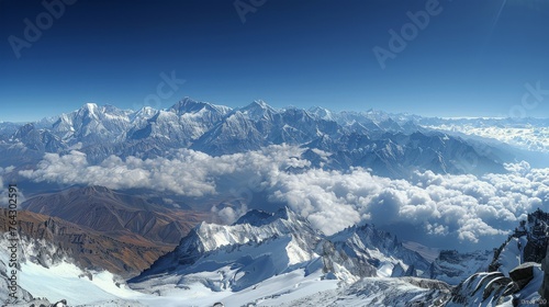 Snow-Covered Mountain Range in Clouds