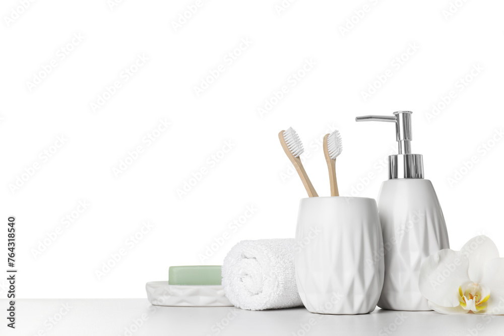 Bath accessories. Different personal care products and flower on table against white background. Space for text Bath accessories. Different personal care products and flower on table against white background. Space for text
